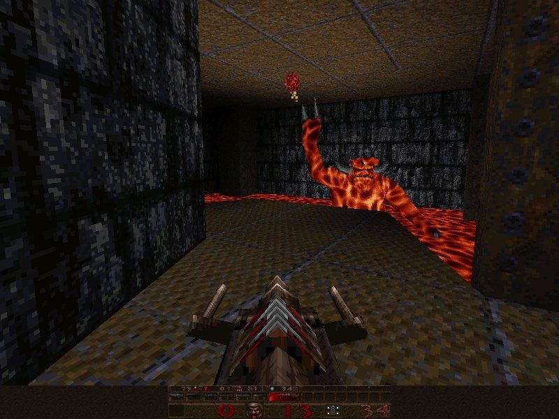 A dark stone corridor filled with dangerous traps and monsters in Quake Mission Pack 2